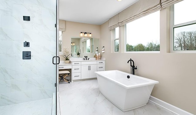 full bath with vanity, plenty of natural light, a marble finish shower, and marble finish floor