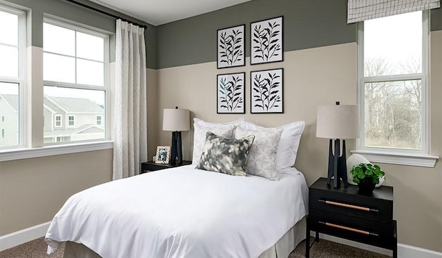 bedroom with carpet and baseboards
