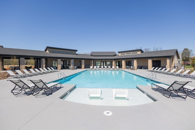 pool featuring fence and a patio