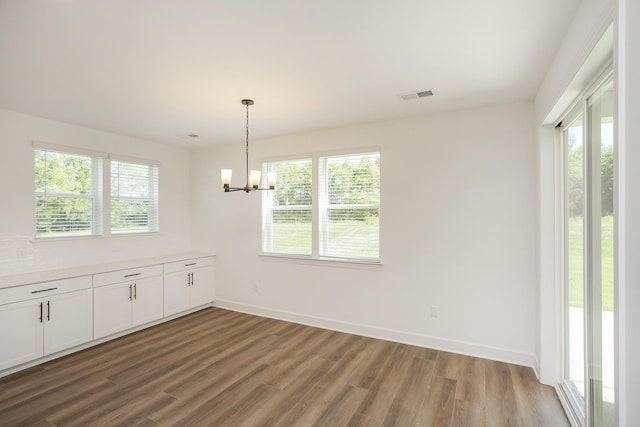 135 W Cassa Way, Mount Juliet, TN 37122 - unfurnished dining area with plenty of natural light, light wood finished floors, and a chandelier