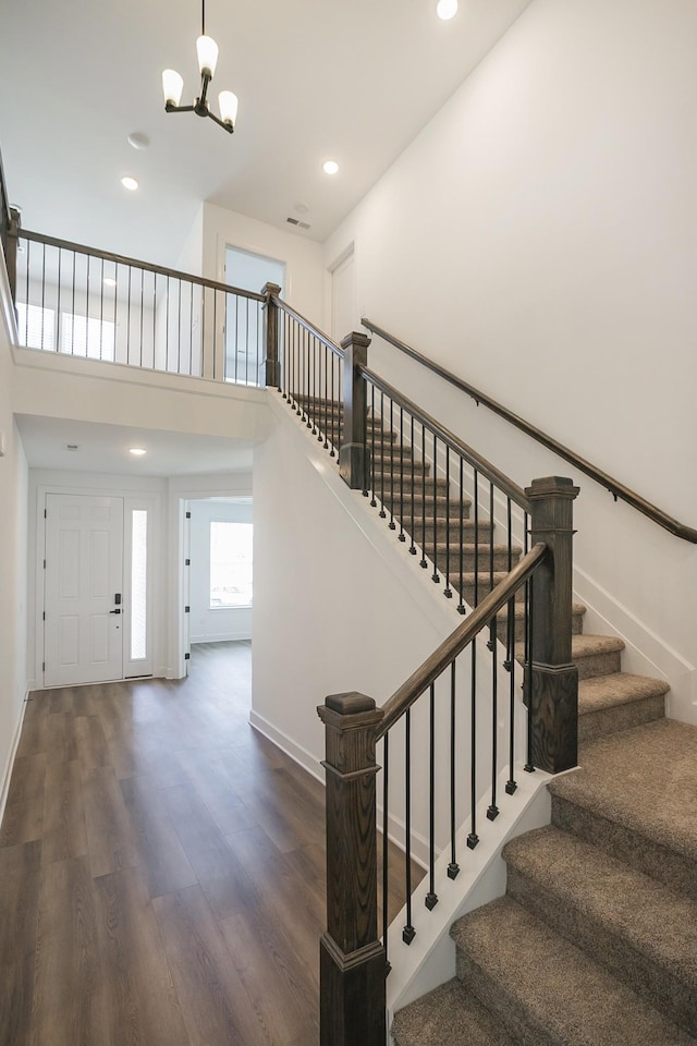135 W Cassa Way, Mount Juliet, TN 37122 - stairway featuring wood finished floors, a chandelier, baseboards, a towering ceiling, and recessed lighting