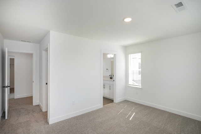 135 W Cassa Way, Mount Juliet, TN 37122 - unfurnished bedroom featuring light carpet, baseboards, a sink, and ensuite bathroom