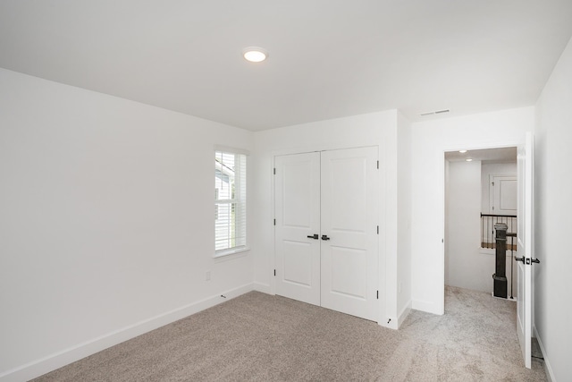 135 W Cassa Way, Mount Juliet, TN 37122 - unfurnished bedroom with light carpet, a closet, baseboards, and recessed lighting