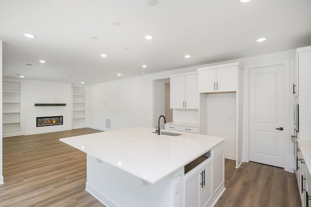 135 W Cassa Way, Mount Juliet, TN 37122 - kitchen with a sink, an island with sink, light wood finished floors, white cabinetry, and recessed lighting