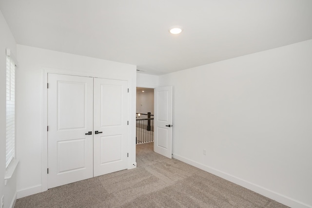 135 W Cassa Way, Mount Juliet, TN 37122 - unfurnished bedroom with carpet flooring, baseboards, a closet, and recessed lighting