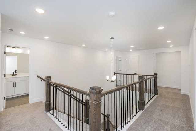 135 W Cassa Way, Mount Juliet, TN 37122 - corridor featuring light colored carpet, an upstairs landing, recessed lighting, a sink, and baseboards