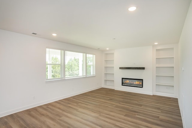 136 W Cassa Way, Mount Juliet, TN 37122 - unfurnished living room with built in features, wood finished floors, baseboards, and recessed lighting