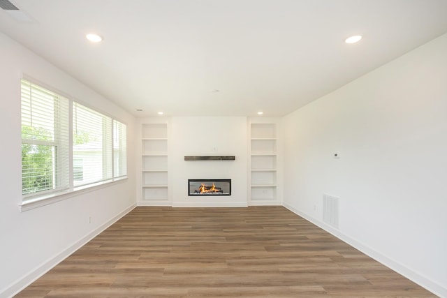 136 W Cassa Way, Mount Juliet, TN 37122 - unfurnished living room with recessed lighting, light wood-type flooring, built in shelves, and baseboards