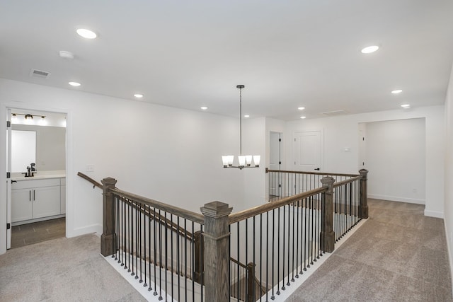 136 W Cassa Way, Mount Juliet, TN 37122 - hallway with carpet, an upstairs landing, recessed lighting, a chandelier, and a sink