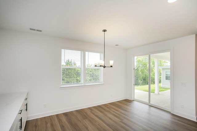 136 W Cassa Way, Mount Juliet, TN 37122 - unfurnished dining area featuring dark wood-style flooring, baseboards, and a chandelier