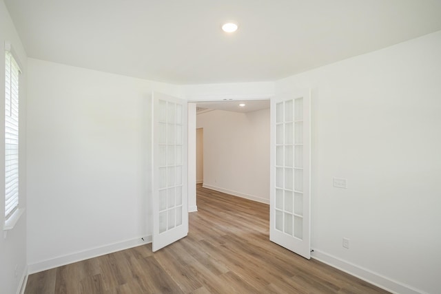 136 W Cassa Way, Mount Juliet, TN 37122 - unfurnished room with wood finished floors, french doors, baseboards, and recessed lighting