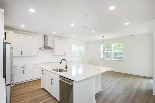 136 W Cassa Way, Mount Juliet, TN 37122 - kitchen with wall chimney range hood, a sink, appliances with stainless steel finishes, light wood-style floors, and light countertops