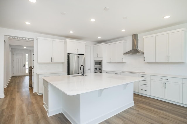 136 W Cassa Way, Mount Juliet, TN 37122 - kitchen featuring wall chimney range hood, appliances with stainless steel finishes, a sink, decorative backsplash, and recessed lighting