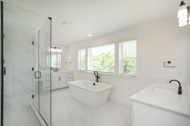 136 W Cassa Way, Mount Juliet, TN 37122 - full bath with marble look tiles, vanity, a marble finish shower, a freestanding bath, and baseboards