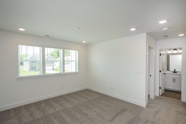136 W Cassa Way, Mount Juliet, TN 37122 - empty room featuring light colored carpet, recessed lighting, baseboards, a sink, and a smoke detector