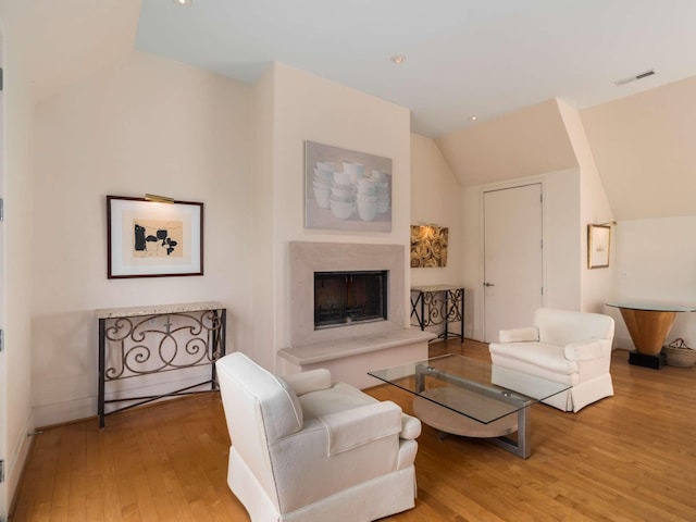 1229 Vintage Pl, Nashville, TN 37215 - living area featuring vaulted ceiling, wood finished floors, a premium fireplace, and recessed lighting