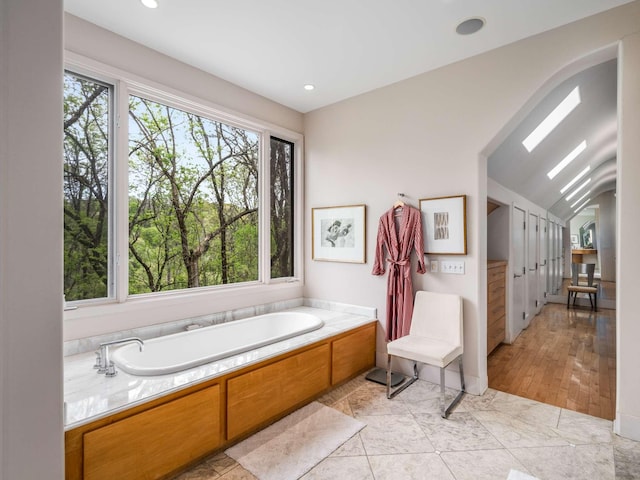 1229 Vintage Pl, Nashville, TN 37215 - bathroom with a bath, recessed lighting, and lofted ceiling