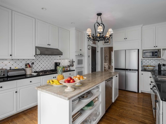 1229 Vintage Pl, Nashville, TN 37215 - kitchen with appliances with stainless steel finishes, under cabinet range hood, a chandelier, open shelves, and white cabinetry