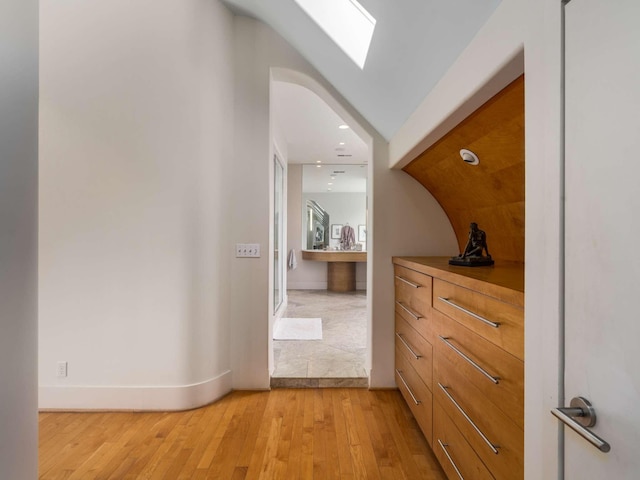 1229 Vintage Pl, Nashville, TN 37215 - hall with light wood-style floors, baseboards, a skylight, and arched walkways