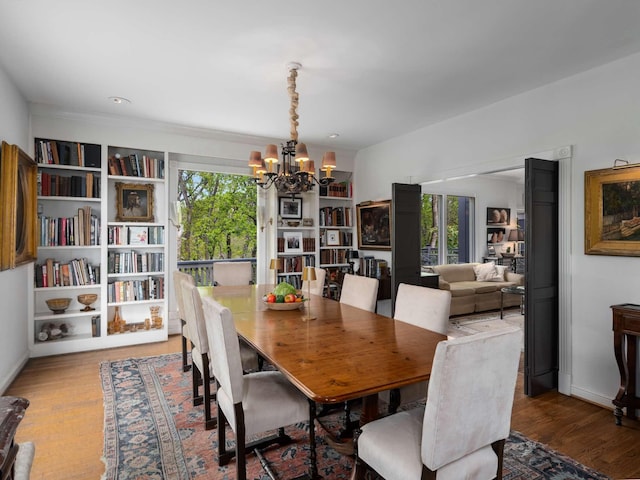 1229 Vintage Pl, Nashville, TN 37215 - dining area featuring a chandelier, wood finished floors, healthy amount of natural light, and baseboards