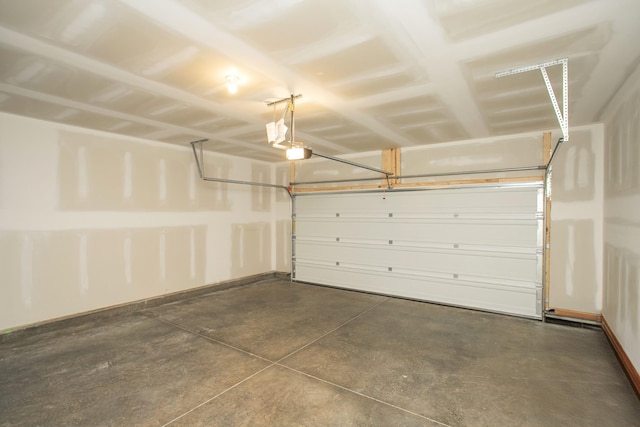 garage featuring baseboards and a garage door opener