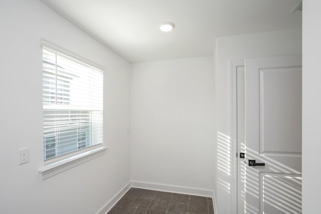 empty room with baseboards