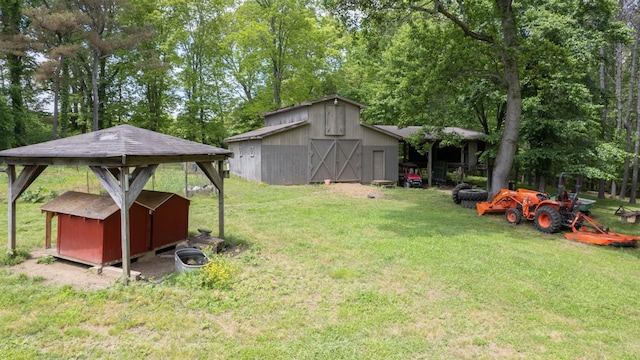 7621 Fernvale Rd, Fairview, TN 37062 - view of green lawn with an outdoor structure, a barn, view of wooded area, and a storage unit