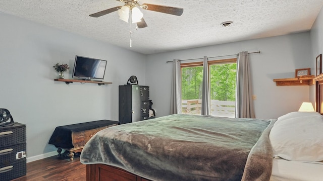 7621 Fernvale Rd, Fairview, TN 37062 - bedroom with dark wood-type flooring, a textured ceiling, access to outside, baseboards, and a ceiling fan