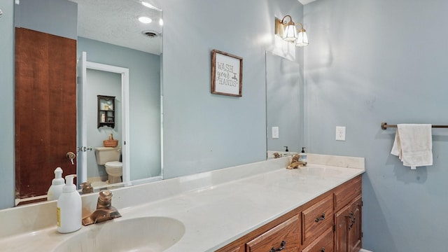 7621 Fernvale Rd, Fairview, TN 37062 - bathroom featuring double vanity and toilet
