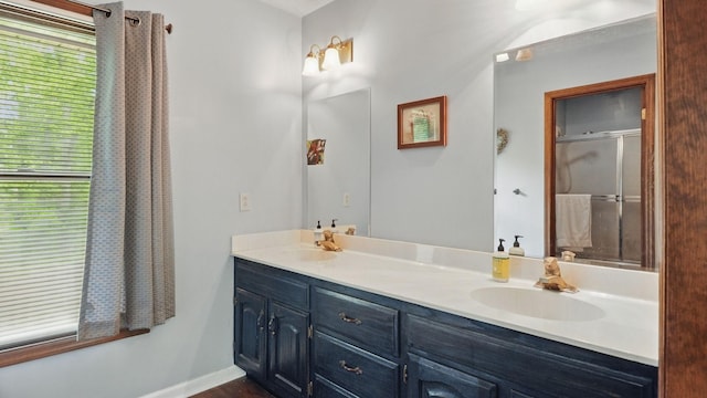 7621 Fernvale Rd, Fairview, TN 37062 - bathroom featuring double vanity, a shower with shower door, and baseboards