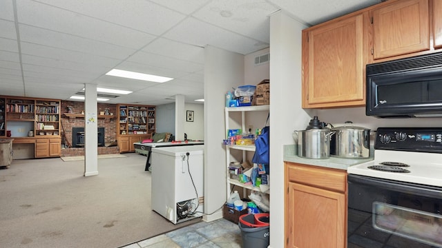 7621 Fernvale Rd, Fairview, TN 37062 - kitchen with electric range oven, black microwave, light countertops, a paneled ceiling, and a brick fireplace