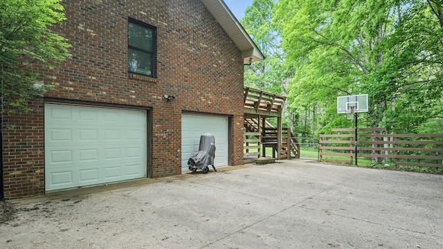 7621 Fernvale Rd, Fairview, TN 37062 - view of side of property featuring a garage, stairs, brick siding, and driveway
