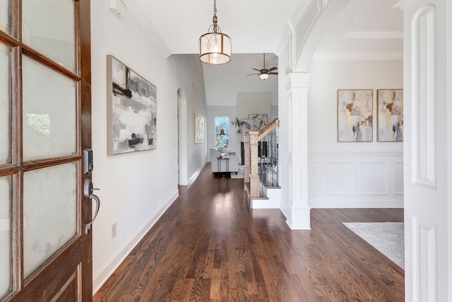 2078 Autumn Ridge Way, Spring Hill, TN 37174 - foyer entrance with arched walkways, decorative columns, ceiling fan, dark wood finished floors, and ornamental molding