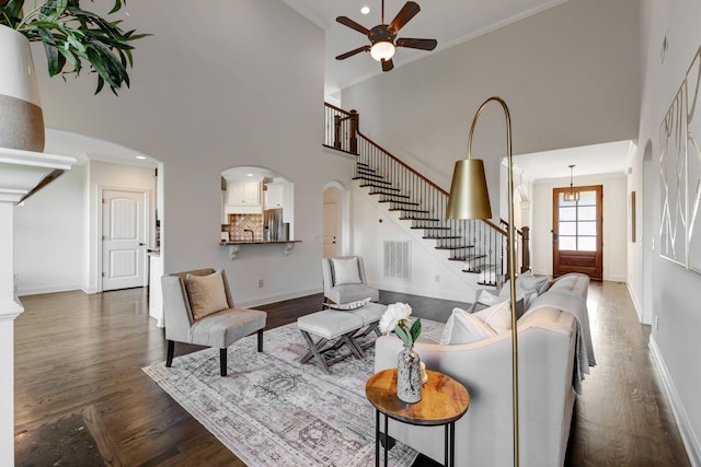 2078 Autumn Ridge Way, Spring Hill, TN 37174 - living area featuring a high ceiling, stairway, dark wood finished floors, a ceiling fan, and baseboards