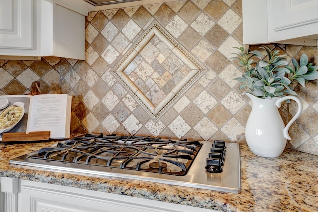 2078 Autumn Ridge Way, Spring Hill, TN 37174 - kitchen featuring stainless steel gas stovetop, white cabinetry, and tasteful backsplash