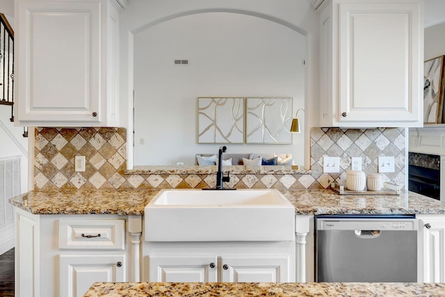 2078 Autumn Ridge Way, Spring Hill, TN 37174 - kitchen featuring stainless steel dishwasher, a sink, decorative backsplash, and white cabinetry