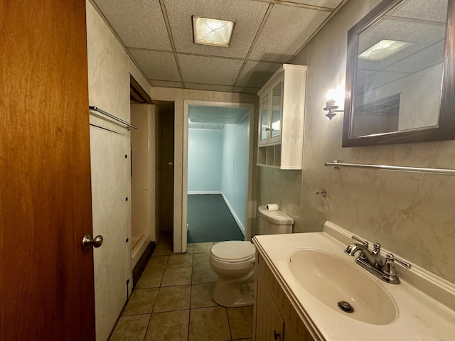bathroom with tile patterned floors, toilet, and vanity