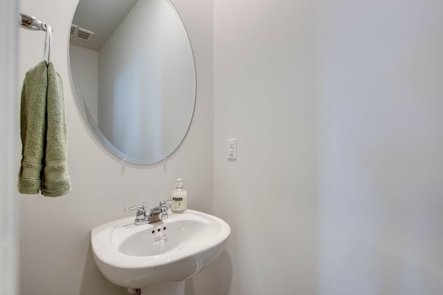 bathroom with a sink and visible vents