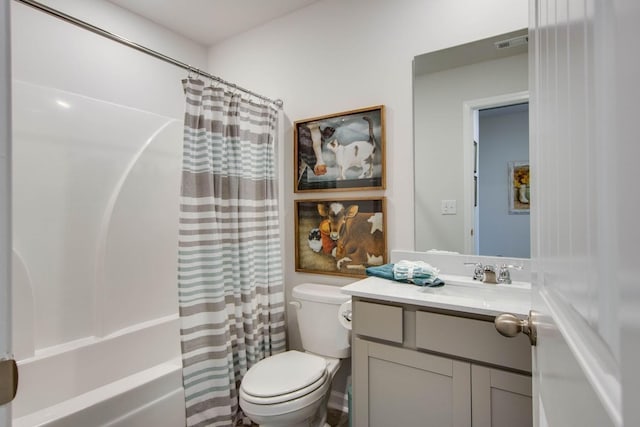 full bath with toilet, vanity, visible vents, and shower / bath combo
