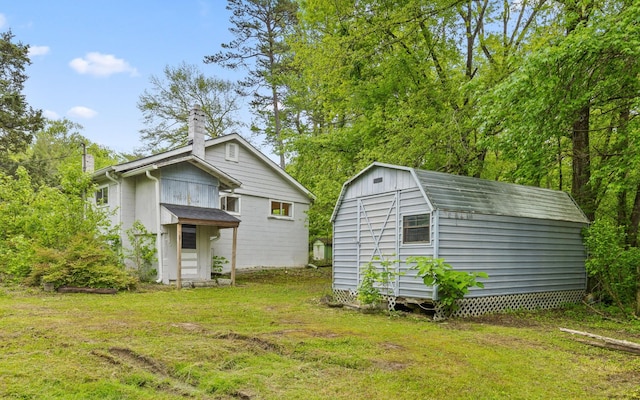 4101 Taft Hwy, Signal Mountain, TN 37377 - back of property featuring a yard, a storage shed, a chimney, and an outbuilding