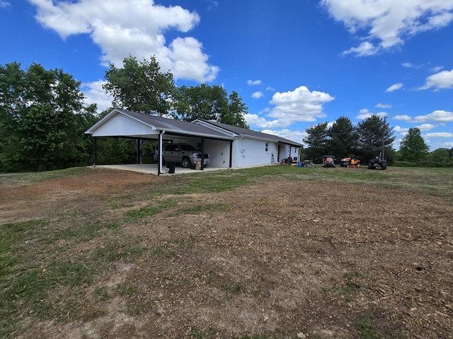 view of yard with an attached carport