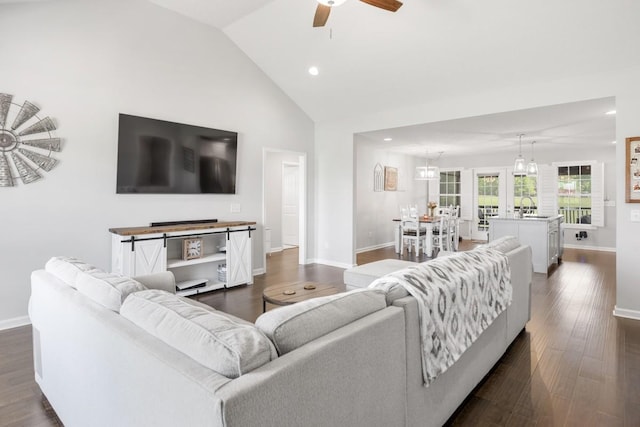 living area featuring dark wood-style flooring, baseboards, ceiling fan, and recessed lighting