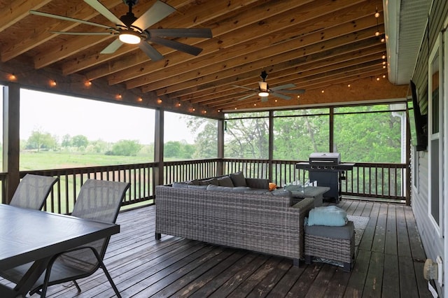 wooden terrace featuring outdoor lounge area, outdoor dining space, ceiling fan, and grilling area