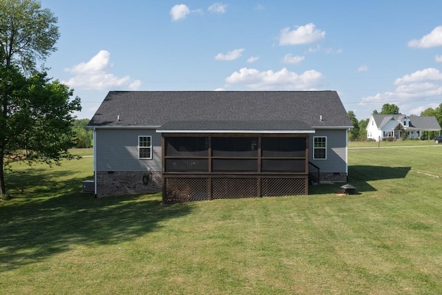 back of house featuring a sunroom, a shingled roof, a yard, and crawl space