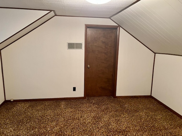 bonus room featuring visible vents, baseboards, and lofted ceiling