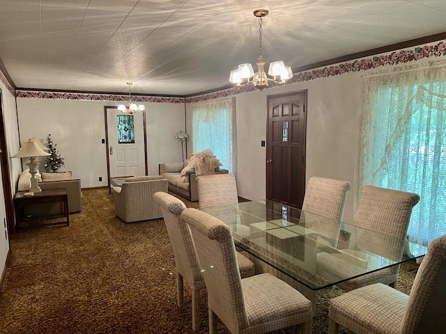 dining space with carpet flooring and a notable chandelier
