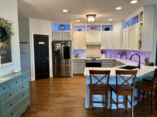 605 Nevins Pl, Nolensville, TN 37135 - kitchen with appliances with stainless steel finishes, a sink, a peninsula, open shelves, and tasteful backsplash