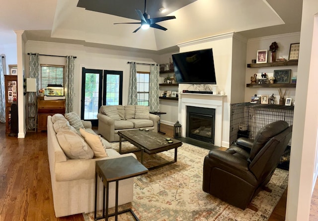 605 Nevins Pl, Nolensville, TN 37135 - living area with a ceiling fan, wood finished floors, a glass covered fireplace, ornamental molding, and a raised ceiling