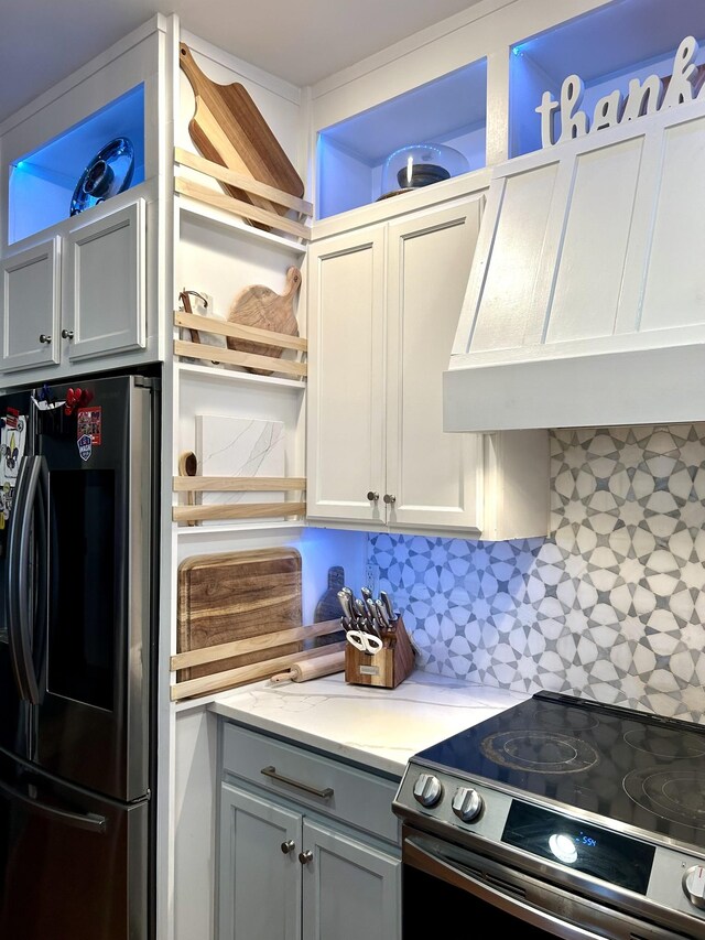 605 Nevins Pl, Nolensville, TN 37135 - kitchen with appliances with stainless steel finishes, wall chimney exhaust hood, open shelves, and gray cabinets