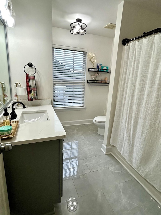 605 Nevins Pl, Nolensville, TN 37135 - full bathroom with toilet, vanity, marble look tile flooring, baseboards, and curtained shower